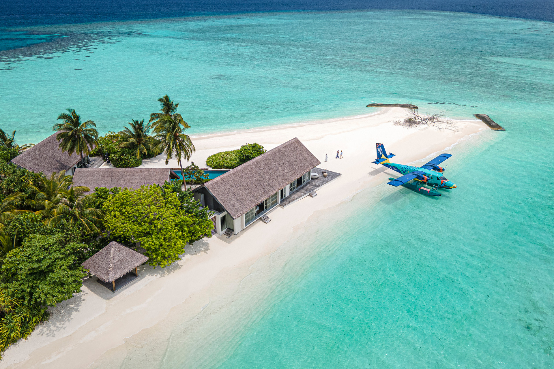 Overwater bungalows in a turquoise lagoon
